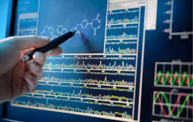 pen pointing at data on computer screen