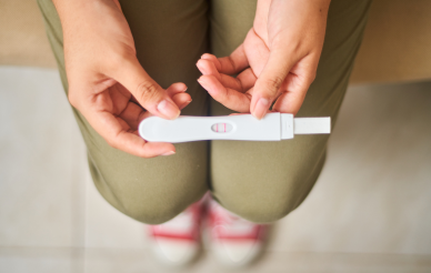 person holding pregnancy test