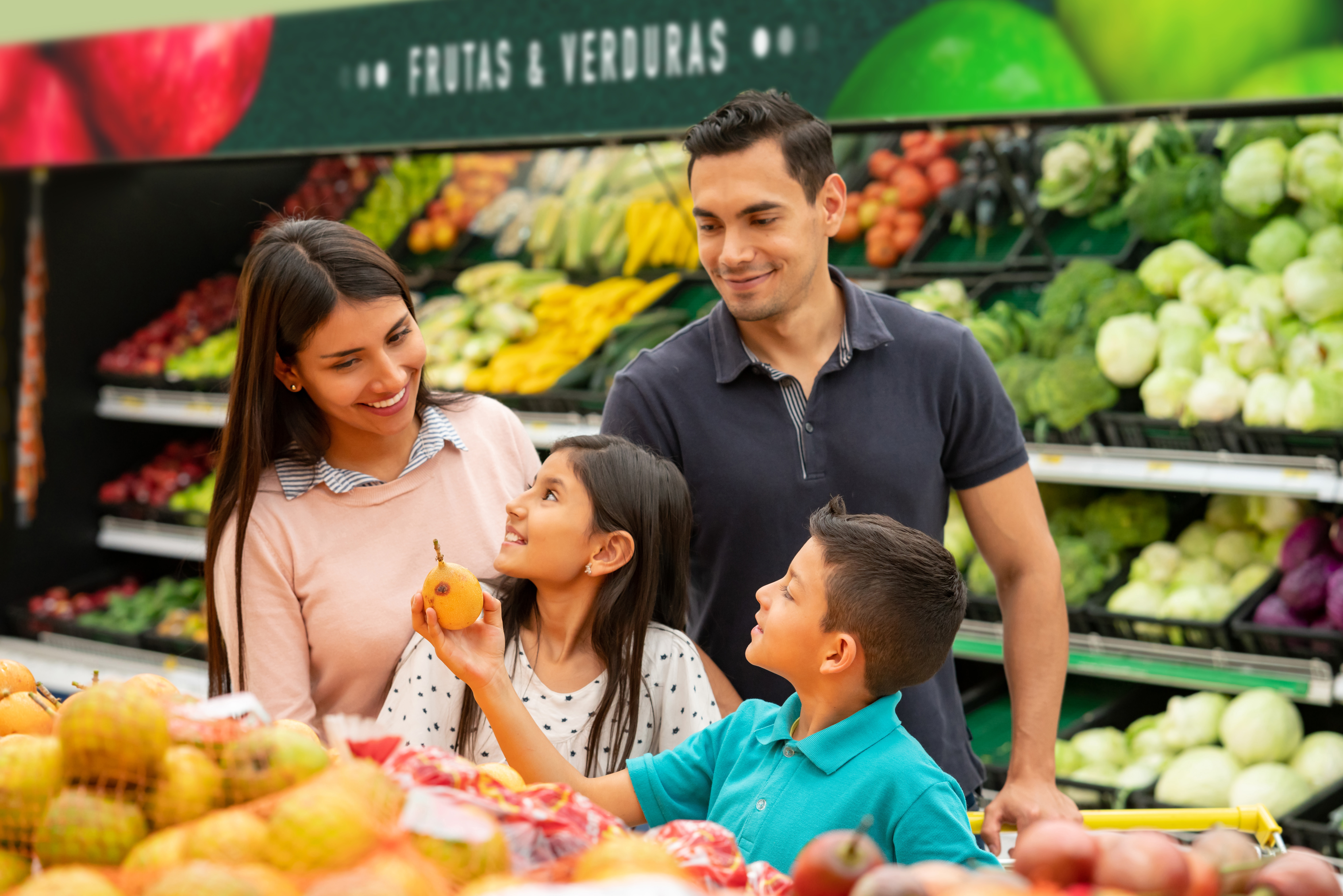 family looking at fruit and vegetables